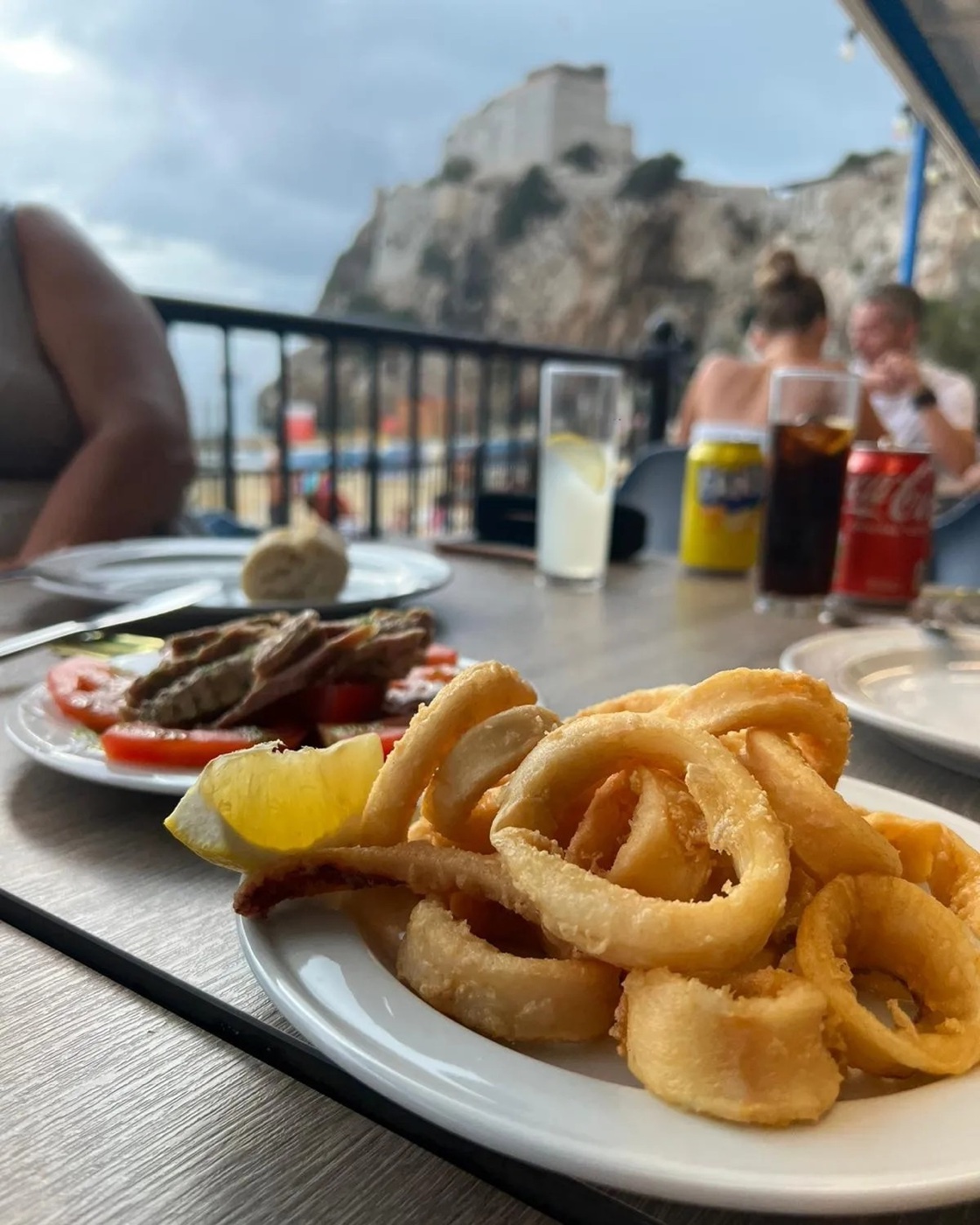 Fried calamari served with the bay in the background
