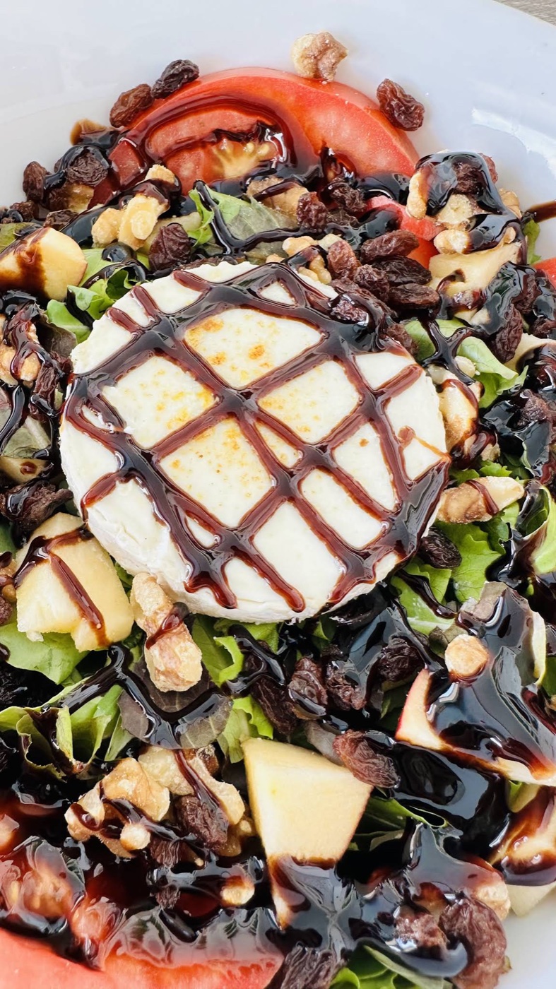 Baked goat cheese salad with walnuts and balsamic
